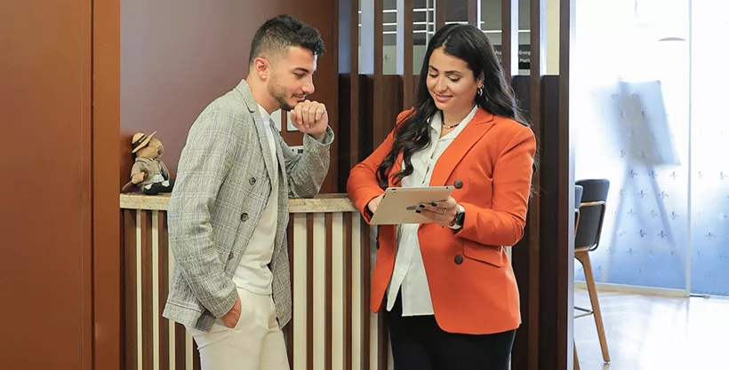 Coworking Space at Beirut Souks with a team member supporting a client with his daily work in a professional environment.