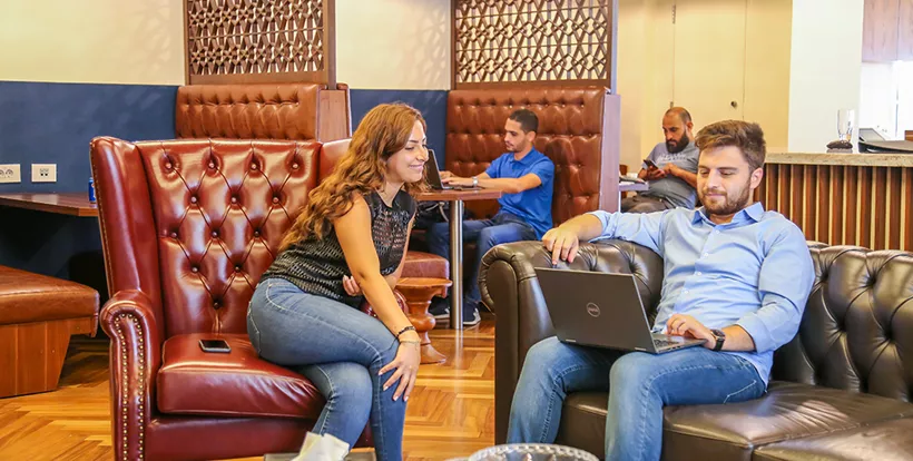 Coworking Space at Beirut Souks with people networking, collaborating, or working at dedicated desks with a luxury fit-out.